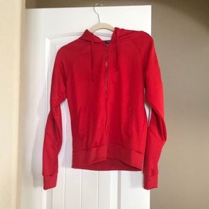 Red jacket with white stripes down the arms